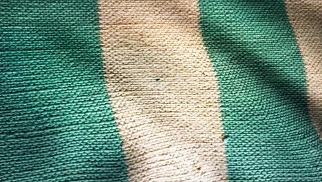 close-up of a green and white striped fabric texture