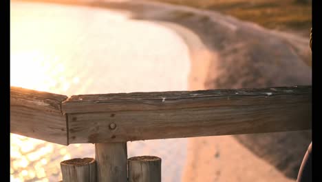 african american male jogger using mobile phone on pier at beach 4k