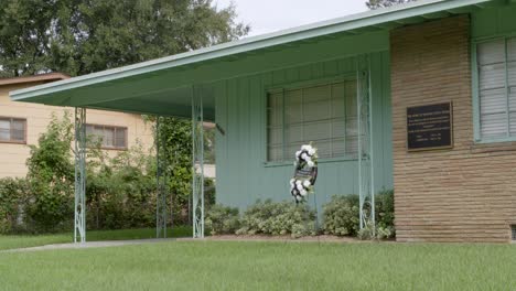 close-up: plaque and wreath. civil rights leader medgar evers home. site of his assassination. jackson, mississippi.