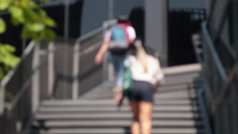 people climbing stairs quickly in daylight