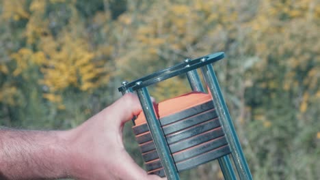 clay pigeons loaded into clay pigeon launcher for outdoor target practice