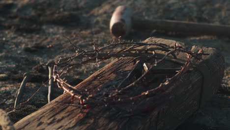 crown of thorns on a wooden plank