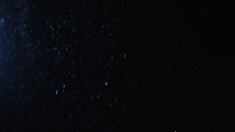 fondo negro de 4k de partículas, polvo y humo en movimiento