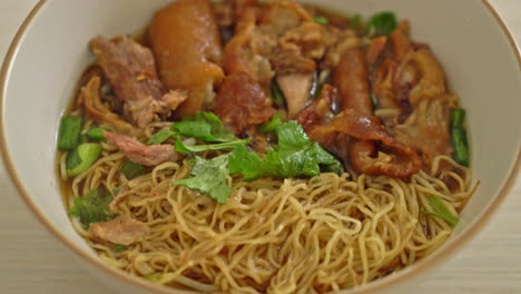 stewed pork leg noodles in brown soup