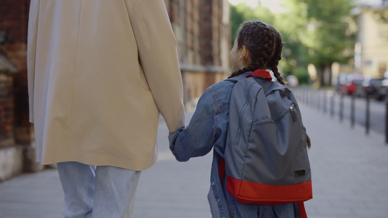 Mother and Daughter Walking to School