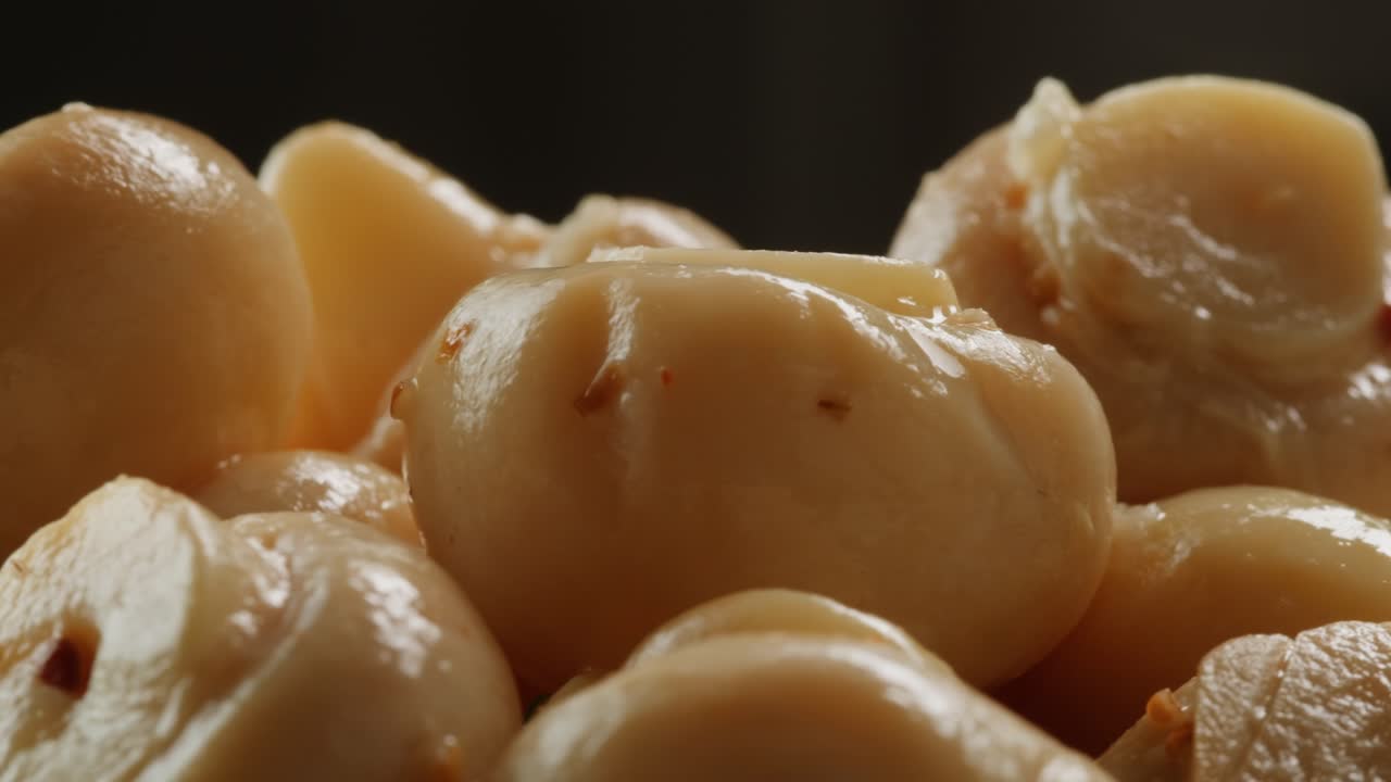 Fermented champignons, Jar with marinated mushrooms on wooden table, traditional salted marinated asian food.
