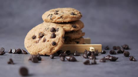 chocolate chip cookies stacked on wooden tray