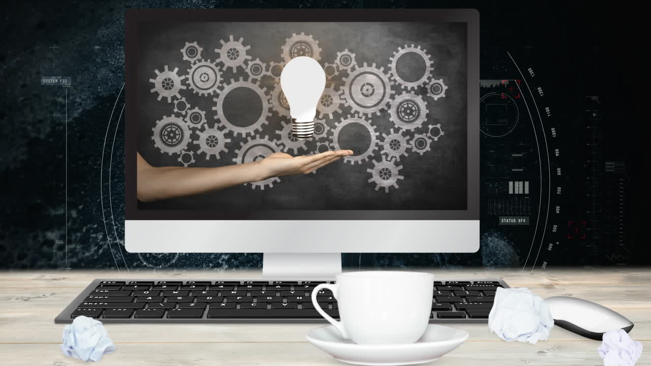 전구와 함께 디지털 애니메이션 화면을 보여주는 컴퓨터