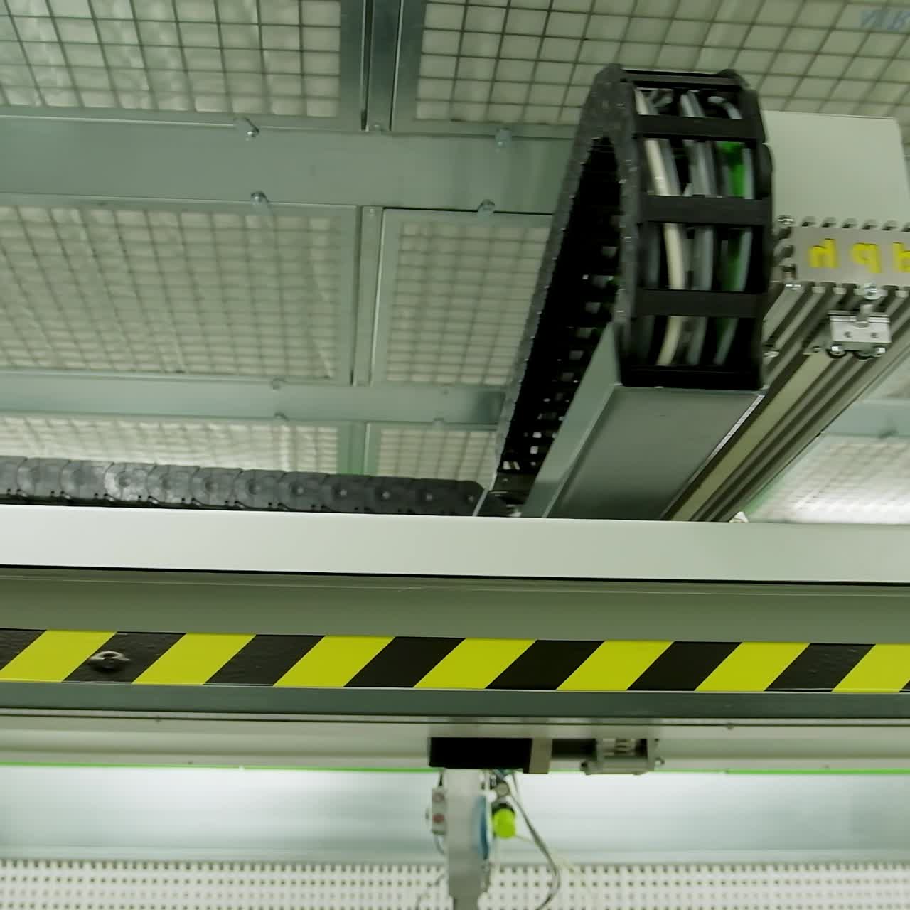 Robotic machine moving inside the plant. Automated device for door production in a modern workshop.