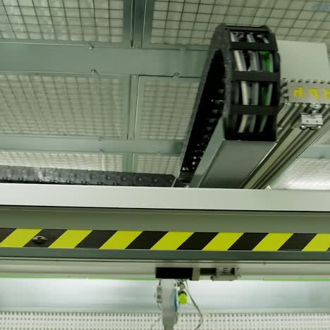 robotic machine moving inside the plant. automated device for door production in a modern workshop.