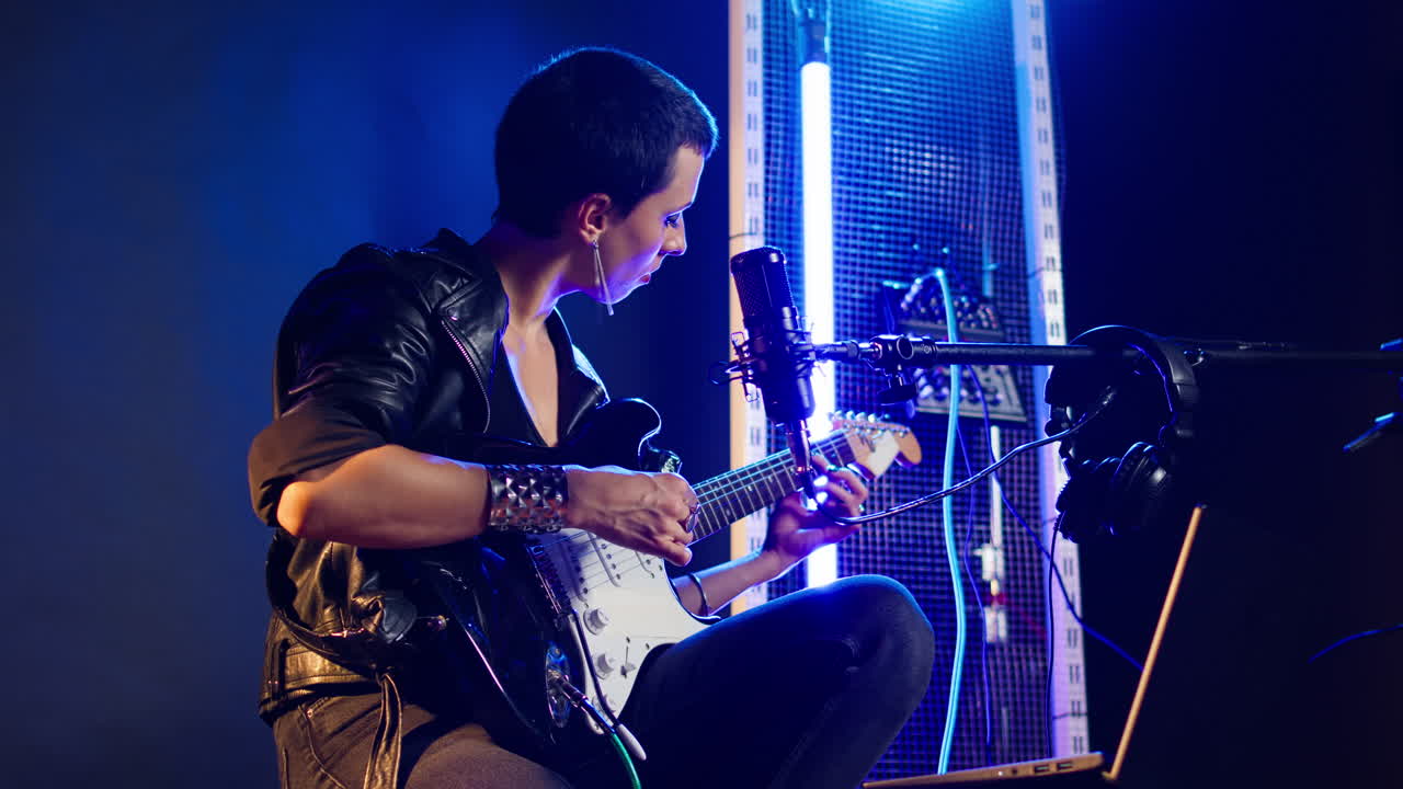 A woman playing guitar