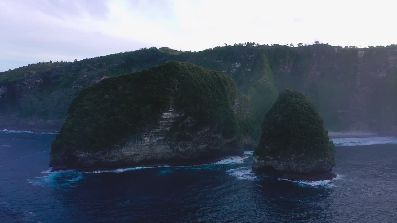Drone flying towards Nusa Penida Kelingking famous viewpoint in Indonesia