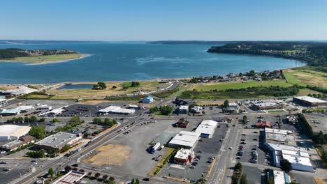 drone shot of oak harbor's main street amenities with the harbor off in the distance