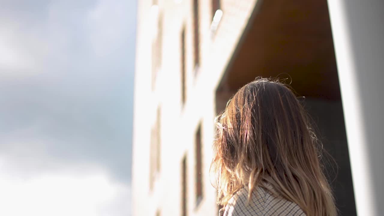 A beautiful shot of a girl staring into te sky.