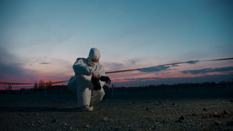 scientist taking photos at a hazardous location at sunset
