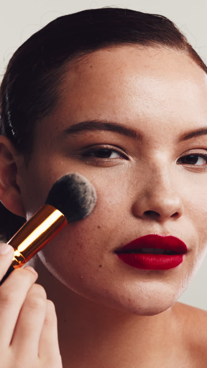 Close-Up of Woman Applying Makeup with a Brush
