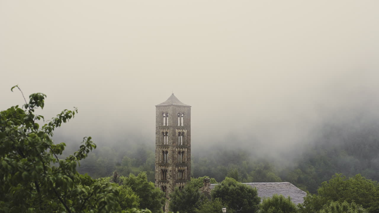 old stone church in foggy misty natural mountains landscape in Aig&uuml;estortes National Park located in the Catalan Pyrenees Spain