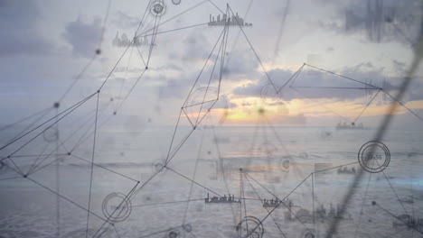 animation of digital network and data visualization over ocean at sunset
