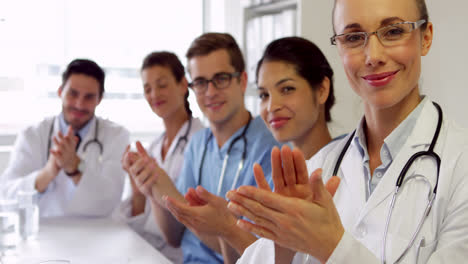 Medical-team-clapping-at-camera
