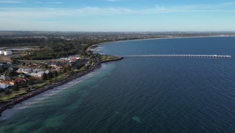 Aerial-establishing-shot-of-Esperance-Town-with-dock-and-beach-during-sunset-time-on-Western-Australia