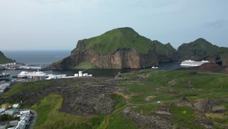 old fishing town welcoming cruise ships gazing towards surreal landscape