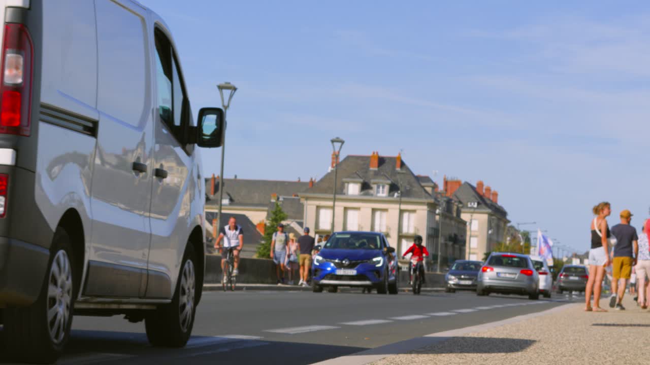 Bridge with Traffic including Vans and Cars Travelling Over with Old Buildings and Houses 4K