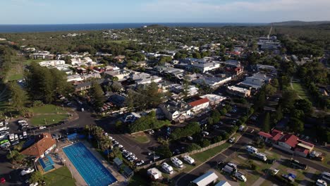 Town Centre Of Byron Bay On Sunny Day In Summer. New South Wales, Australia. Main Beach Revealed. aerial sideways shot