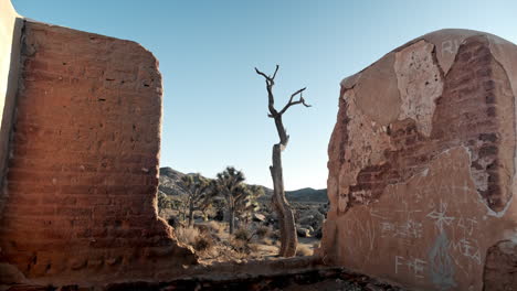 pan down on rocky ruins in california desert, clear sunny day in joshua tree