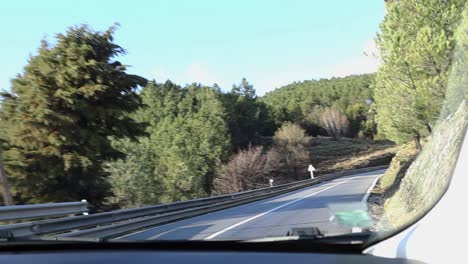 sharp turn in serra da estrela natural park on steep winding roads with rocky cliff and guard railing