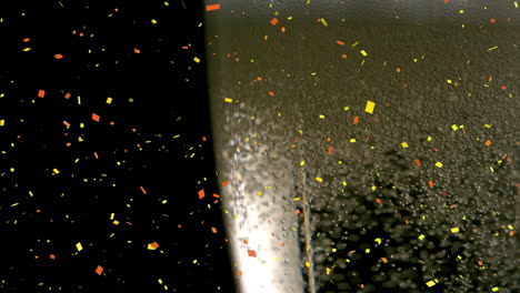 animation of confetti falling and bubbles rising in glass of champagne on black background