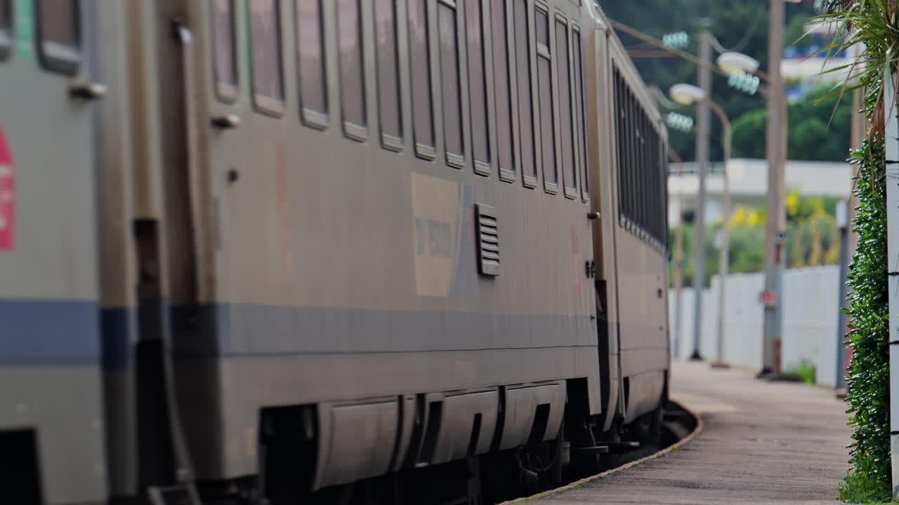 Cannes, France - February 4, 2025: Trains moving on the rails near a train station