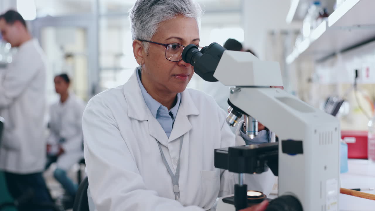 Senior woman, scientist and microscope