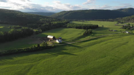 Fly-Over-Drone-Footage-overlooking-farmhouse-at-Restigouche,-New-Brunswick,-Canada