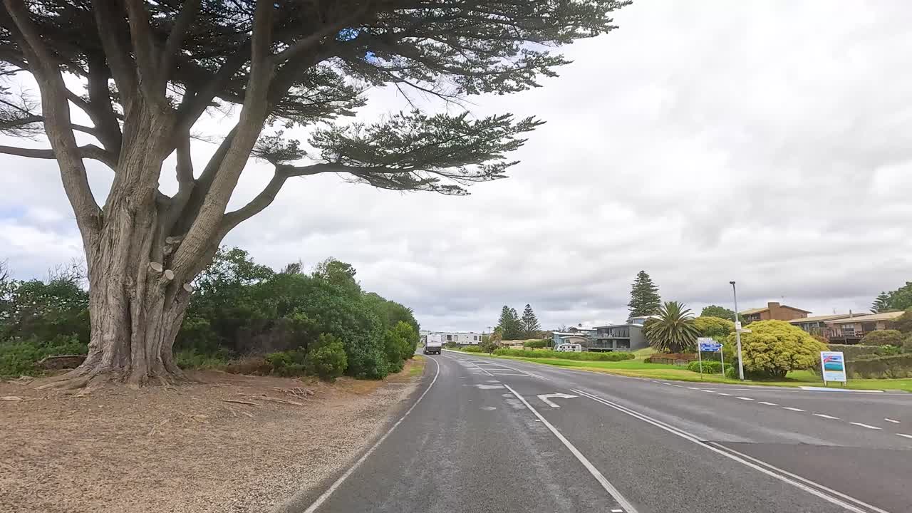 A 30-second drive showcasing lush greenery and coastal views along the Great Ocean Road in Victoria, Australia