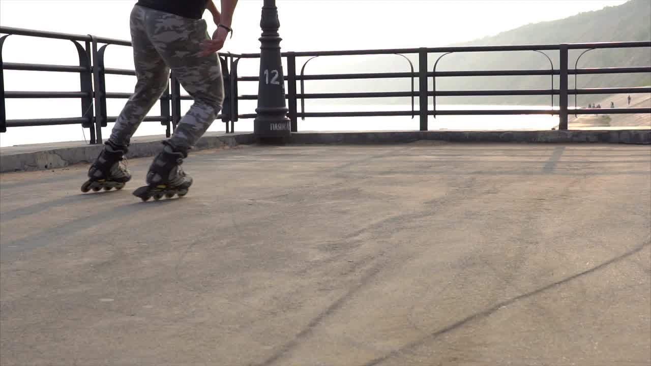 Person rollerblading on a riverside path