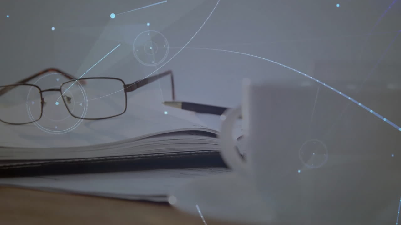 Creative desk being animated in flat design, showing open notebook, pencil, glasses and coffee mug