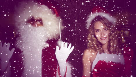 santa claus y la mujer en el baile de disfraces de navidad para el rodaje de discoteca de navidad