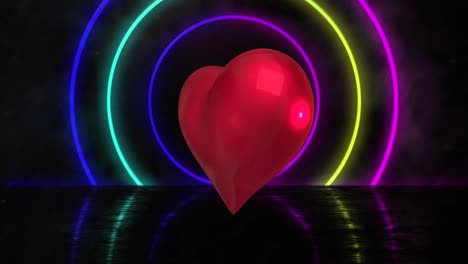 Animation-of-heart-balloon-and-neon-circles-on-black-background