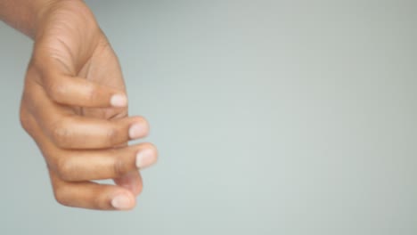 Hands holding a date fruit