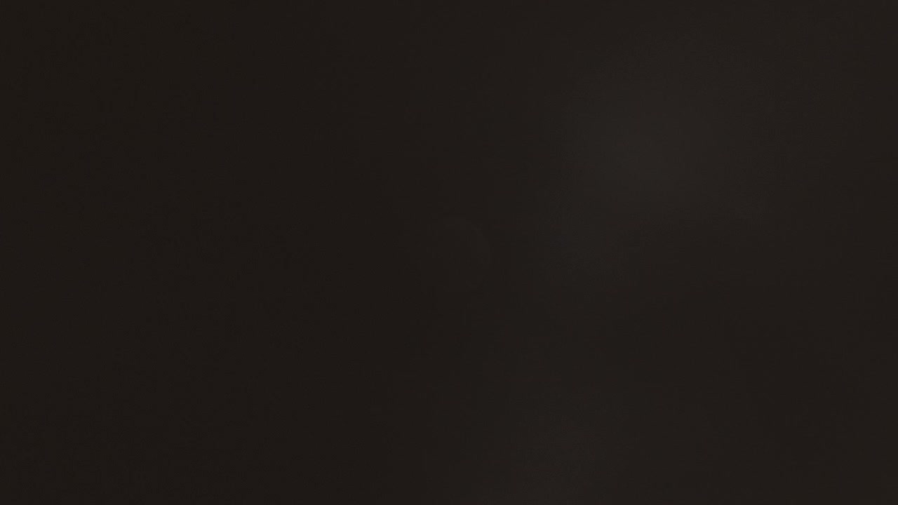 time lapse of full moon moving from left to right across a night sky partially or completely obscured by clouds at different times throughout the sequence