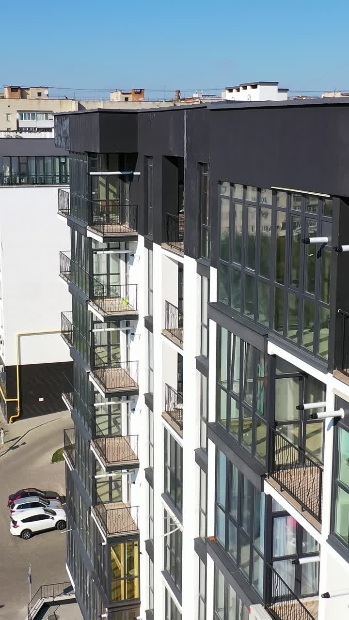 Urban cityscapes architecture exterior construction. Modern buildings aerial view. Vertical video