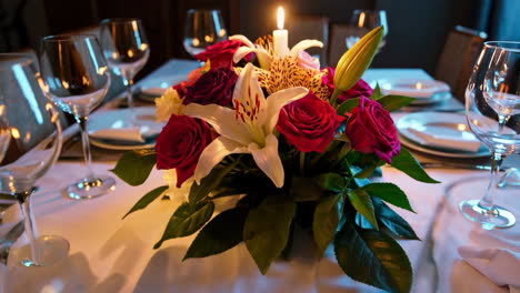 elegant dining table setting with candlelight and floral centerpiece