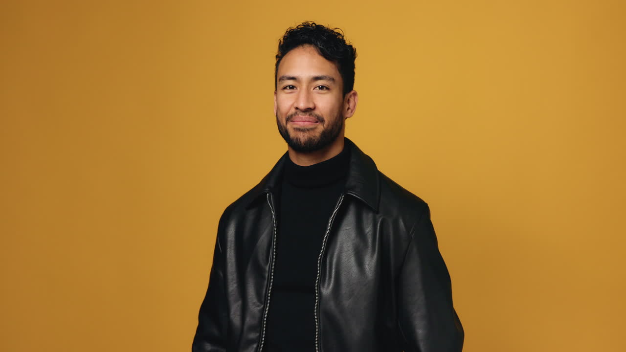Portrait of a smiling man in a leather jacket