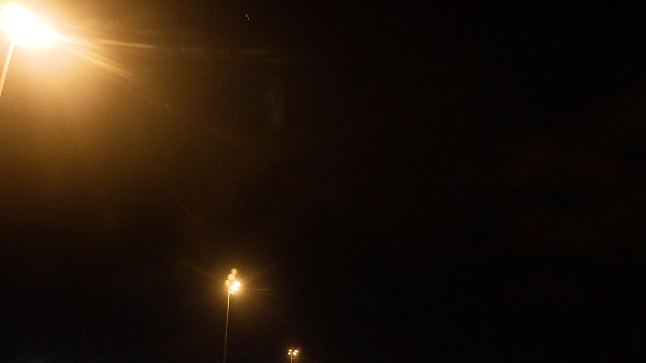 Night Airport Scene with Aircraft and Ground Crew