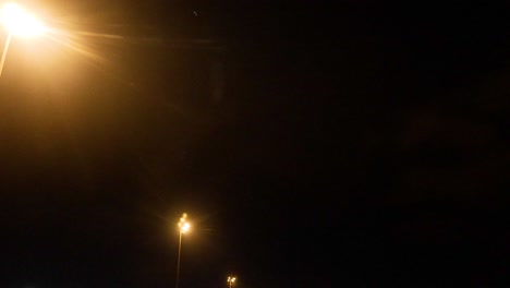 night airport scene with aircraft and ground crew