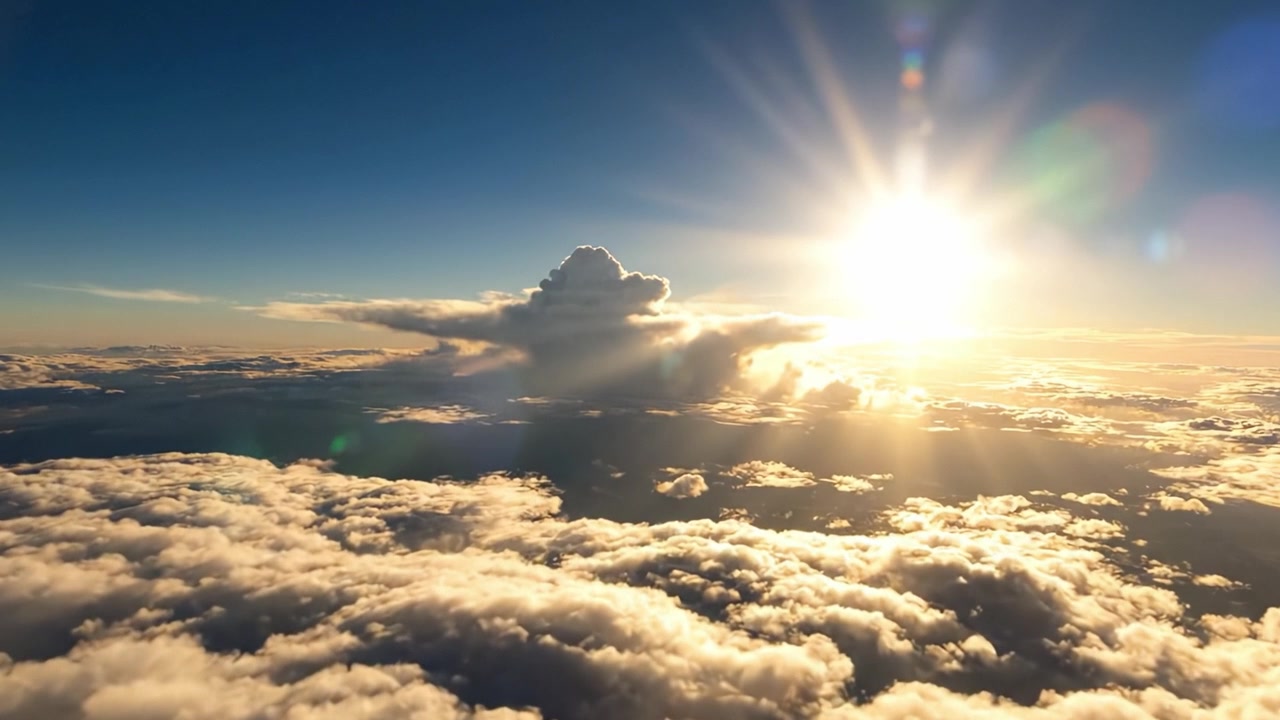 Alba mozzafiato sopra le nuvole catturata dall'alto, che mostra bellissimi effetti atmosferici e la luce naturale che illumina il cielo con colori vivaci.
