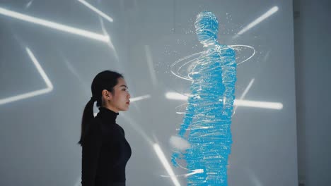 woman looking at a futuristic hologram