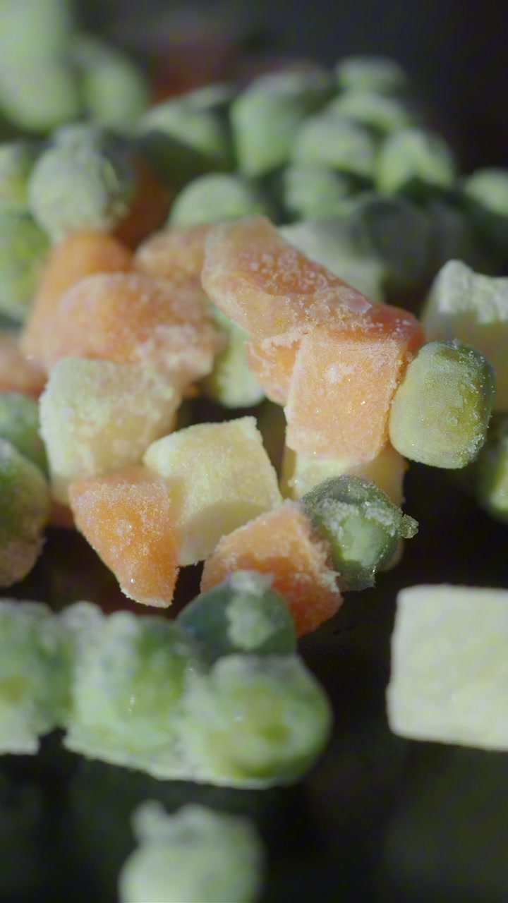 Frozen Diced Carrots and Peas Covered in Frost