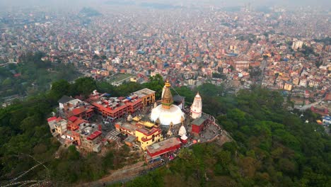 drone shot flying backwards over swayambhunath stupa in kathmandu city