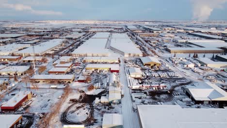 A-revealing-shot-of-a-massive-industrial-area-and-a-steaming-power-plant-in-Canada-during-winter